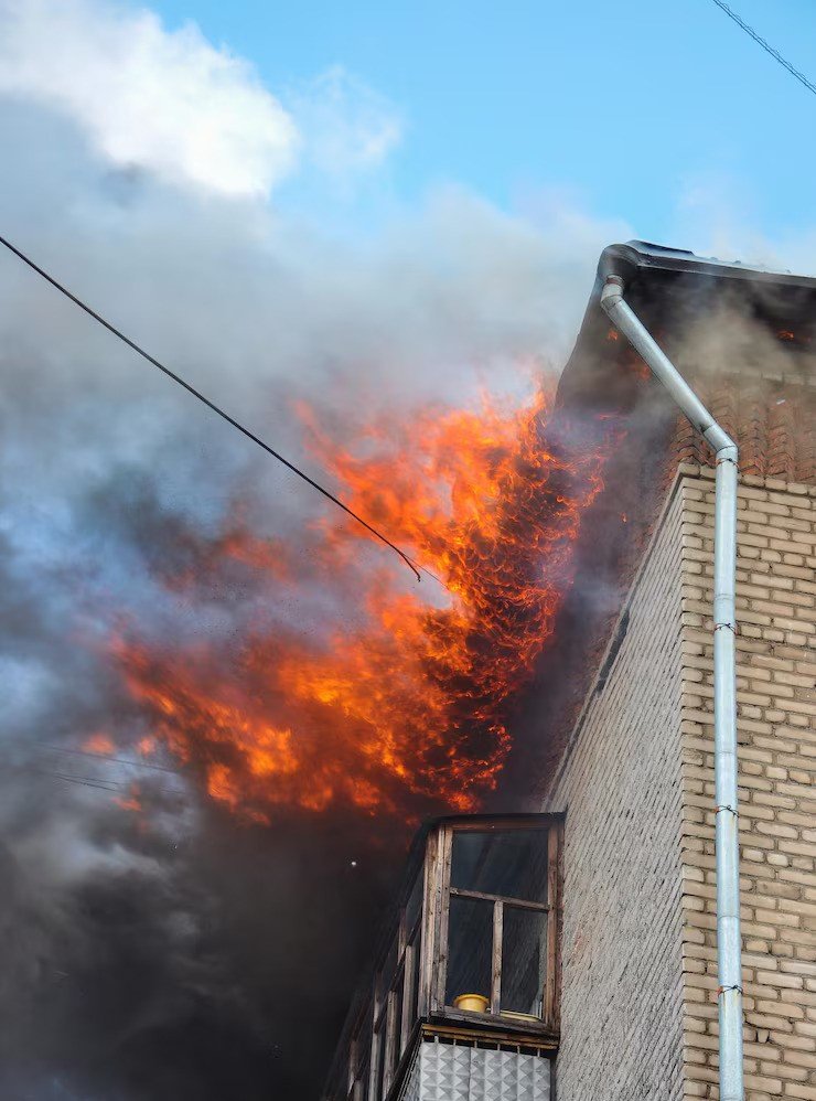 fire-apartment-building-top-floor_220838-730