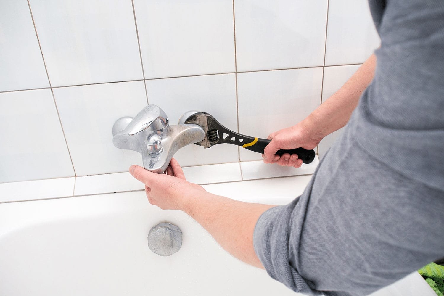 man-fixing-faucet